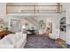Spacious living room featuring a grand staircase and an open floor plan at 10508 Old Wayside Rd, Charlotte, NC 28277