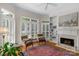 Inviting living room area with fireplace, built-in shelving and comfortable seating at 10508 Old Wayside Rd, Charlotte, NC 28277