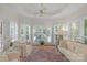 Cozy sunroom filled with natural light from many windows and shutter design at 10508 Old Wayside Rd, Charlotte, NC 28277