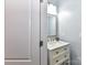 Bright half bathroom with modern vanity, quartz countertop, and elegant fixtures at 10800 Alabaster Dr, Davidson, NC 28036