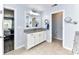 Bathroom featuring a granite vanity with white cabinets and views of the bedroom and toilet space at 10800 Alabaster Dr, Davidson, NC 28036