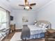 Comfortable bedroom with ceiling fan, stylish decor, and a serene ambiance at 10800 Alabaster Dr, Davidson, NC 28036
