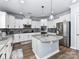 Modern kitchen featuring white cabinets, granite countertops, and stainless steel appliances at 10800 Alabaster Dr, Davidson, NC 28036