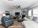 Spacious living room with fireplace, ceiling fan, and comfortable seating at 10800 Alabaster Dr, Davidson, NC 28036