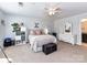 Spacious main bedroom with a ceiling fan, carpet, and gray walls at 10800 Alabaster Dr, Davidson, NC 28036