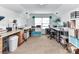 Bright office space with multiple desks and storage shelves at 10800 Alabaster Dr, Davidson, NC 28036