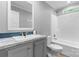 Bathroom features a vanity with a mirror, toilet, and shower-tub combination at 110 Lambert Ln, Statesville, NC 28677