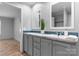 Bathroom featuring a modern vanity with double mirrors, a sink, and stylish fixtures, exuding elegance at 110 Lambert Ln, Statesville, NC 28677