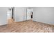 A spacious bedroom is shown, with an ensuite bathroom and an entryway, all featuring modern flooring at 110 Lambert Ln, Statesville, NC 28677