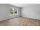 A bright bedroom features two windows that provide natural light and views of the outdoors at 110 Lambert Ln, Statesville, NC 28677