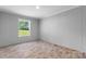 Bedroom featuring wood-look floors and a window with natural light at 110 Lambert Ln, Statesville, NC 28677