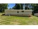 Home exterior shows siding, brick foundation and manicured lawn at 110 Lambert Ln, Statesville, NC 28677