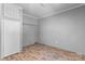 Empty laundry room with white door, shelves and hookups for appliances at 110 Lambert Ln, Statesville, NC 28677