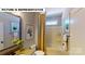 Well-lit bathroom with a shower-tub combination, vanity with modern fixtures, and decorative artwork at 124 S Shayna Rd, Troutman, NC 28166