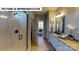 Bathroom with glass-enclosed shower, long vanity with storage, and decorative accents at 124 S Shayna Rd, Troutman, NC 28166