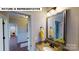 Bathroom featuring modern vanity with sink, mirror, and decorative elements at 124 S Shayna Rd, Troutman, NC 28166
