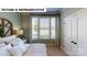 Inviting bedroom with a large window, stylish curtains, and a cozy bed with white linens at 124 S Shayna Rd, Troutman, NC 28166
