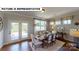 Bright dining area with access to a back patio through glass doors, featuring stylish decor at 124 S Shayna Rd, Troutman, NC 28166