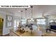 Modern kitchen featuring an island, pendant lighting, and an open floor plan to living spaces at 124 S Shayna Rd, Troutman, NC 28166
