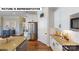 Bright kitchen features stainless steel appliances, white cabinets, and a light-colored countertop at 124 S Shayna Rd, Troutman, NC 28166