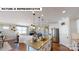 Spacious kitchen featuring an island, stainless steel appliances, and a seamless flow to living areas at 124 S Shayna Rd, Troutman, NC 28166