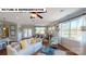 Bright living room featuring a comfortable sofa, hardwood floors, and a view into the dining area at 124 S Shayna Rd, Troutman, NC 28166