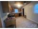 Functional kitchen features tile flooring, wooden cabinetry, and a window for natural light at 1313 Lower Dallas Hwy Hwy, Dallas, NC 28034