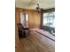 Spacious living room featuring wood-paneled walls and a ceiling fan at 1313 Lower Dallas Hwy Hwy, Dallas, NC 28034