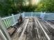 Outdoor patio with a heater and a white railing at 1313 Lower Dallas Hwy Hwy, Dallas, NC 28034