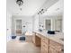 Bright bathroom with double sinks, large mirror, soaking tub, and tile flooring at 139 Forest Walk Way, Mooresville, NC 28115