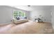 Bright bedroom with a large window, neutral carpet, and ample space for furniture at 139 Forest Walk Way, Mooresville, NC 28115