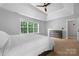 Bright bedroom with tray ceiling, neutral walls and carpet, along with a large window at 139 Forest Walk Way, Mooresville, NC 28115