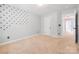 Bright bedroom features neutral walls and carpet, and a hallway at 139 Forest Walk Way, Mooresville, NC 28115