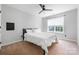 Bright bedroom with neutral walls, fan, and large window at 139 Forest Walk Way, Mooresville, NC 28115