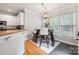Charming breakfast nook with modern light fixture and a view of the backyard at 139 Forest Walk Way, Mooresville, NC 28115