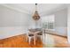 Elegant dining room featuring hardwood floors, stylish chandelier, and decorative trim at 139 Forest Walk Way, Mooresville, NC 28115