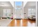 Inviting foyer with soaring ceilings, gleaming hardwood floors, and abundant natural light from large windows at 139 Forest Walk Way, Mooresville, NC 28115