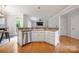 Bright kitchen featuring white cabinetry, wood floors, and stainless steel appliances at 139 Forest Walk Way, Mooresville, NC 28115