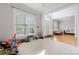 Open living room with ample natural light, neutral colors, and carpeted floors at 139 Forest Walk Way, Mooresville, NC 28115
