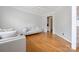Bright living room with gleaming hardwood floors, neutral colors, and views leading to the stairwell at 139 Forest Walk Way, Mooresville, NC 28115