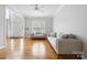 Bright living room with hardwood floors, large windows, and neutral paint enhancing a welcoming ambiance at 139 Forest Walk Way, Mooresville, NC 28115