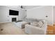 Inviting living room with a fireplace, large TV, and plush sectional sofa at 139 Forest Walk Way, Mooresville, NC 28115