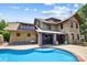 Stunning backyard featuring a sparkling pool and stone details at 14701 Cabarrus Rd, Mint Hill, NC 28227