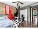 Eclectic bedroom with unique cinder block accent wall, vintage fridge, and state of the art gamer station at 14701 Cabarrus Rd, Mint Hill, NC 28227