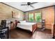 Comfortable bedroom with brick accent wall, and bright window at 14701 Cabarrus Rd, Mint Hill, NC 28227