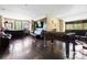 Spacious bonus room with hardwood floors, a foosball table and wall mounted TV at 14701 Cabarrus Rd, Mint Hill, NC 28227
