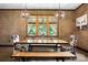 Elegant dining room with contemporary lighting, offering a comfortable and inviting space at 14701 Cabarrus Rd, Mint Hill, NC 28227