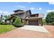 Charming two-story home with a large driveway and attached two-car garage at 14701 Cabarrus Rd, Mint Hill, NC 28227