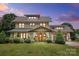 Beautiful two-story home with a manicured lawn and charming covered front porch at 14701 Cabarrus Rd, Mint Hill, NC 28227