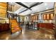 Modern kitchen with a large island and exposed brick walls at 14701 Cabarrus Rd, Mint Hill, NC 28227